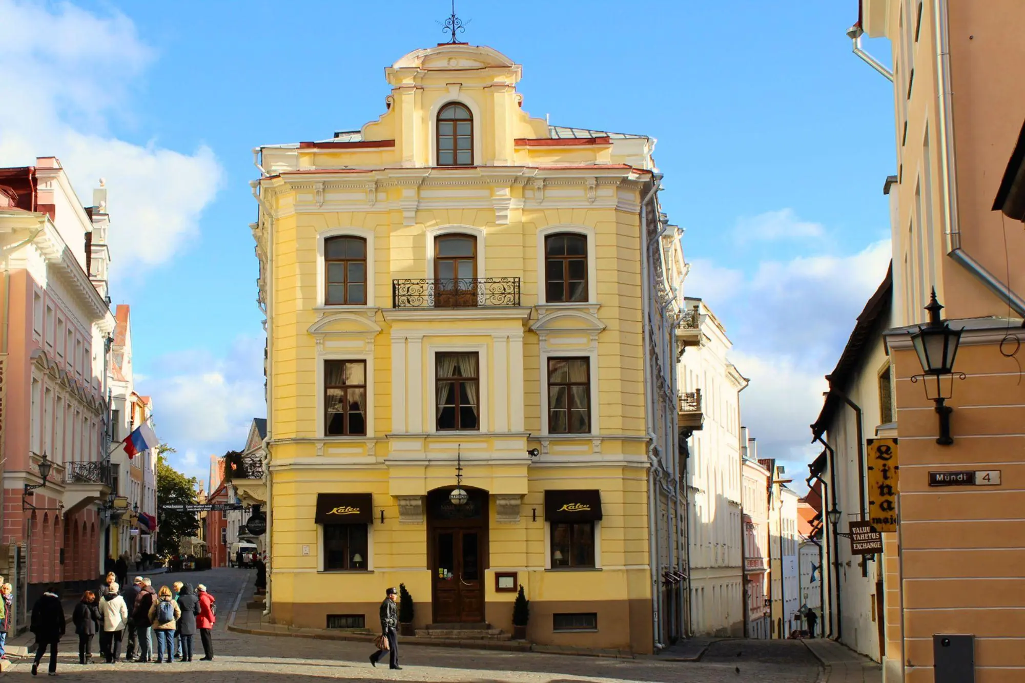 Exterior facade of Maiasmokk Cafe on Pikk street in Tallinn Old Town showing its historic arched wooden windows and entrance