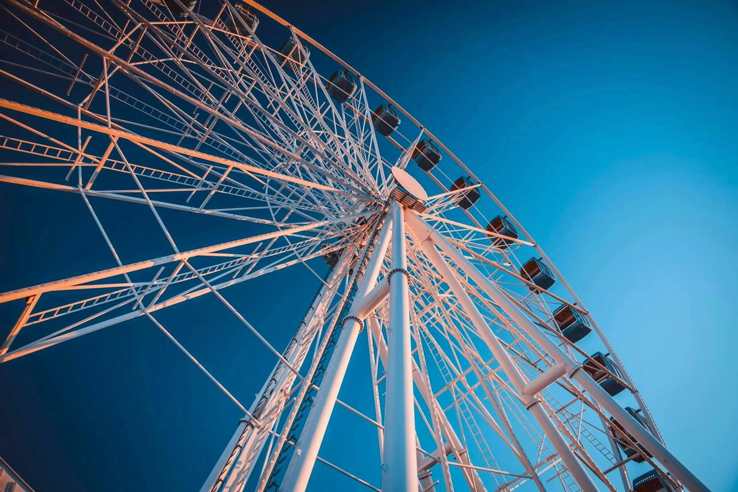 The Skywheel of Tallinn illuminated at dusk on top of the T1 Mall